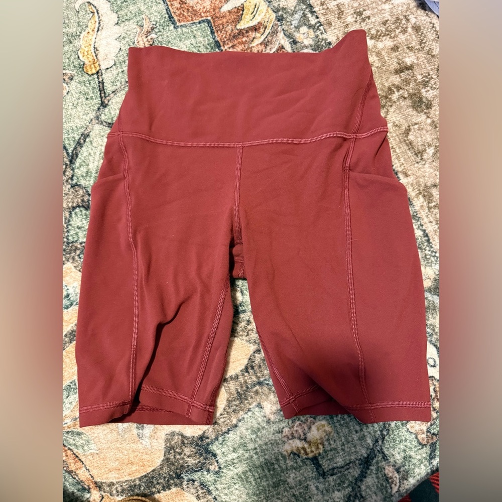Red Lululemon athletic shorts
